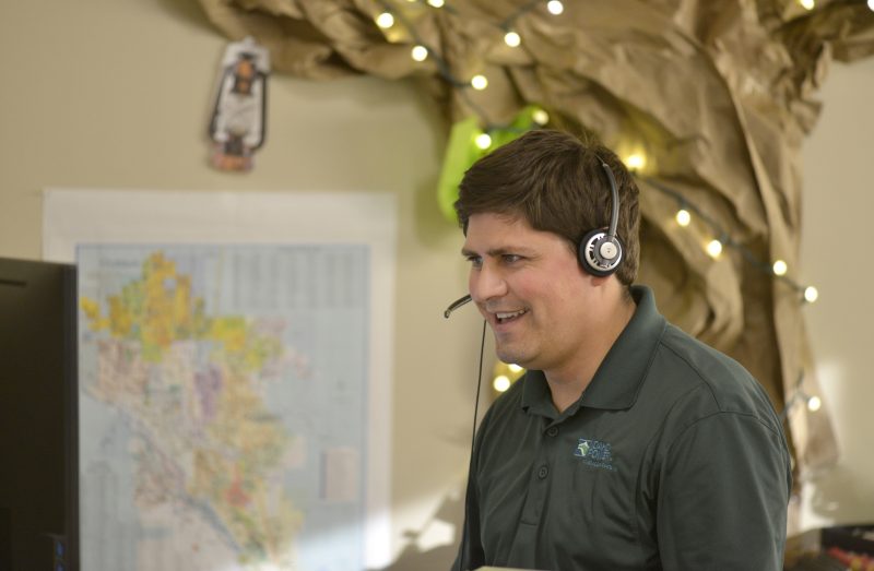 Image of a customer service representative on the phone.