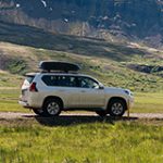 Permalink to Put Safety First During Deadliest Days of Driving Car driving on a dirt road in a scenic setting