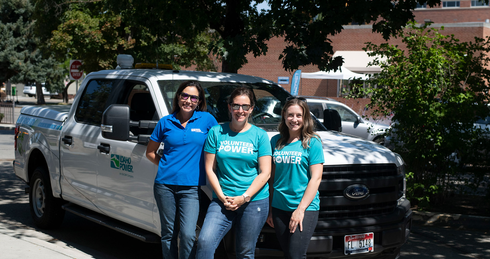 Female employees wearing Volunteer Power shirts