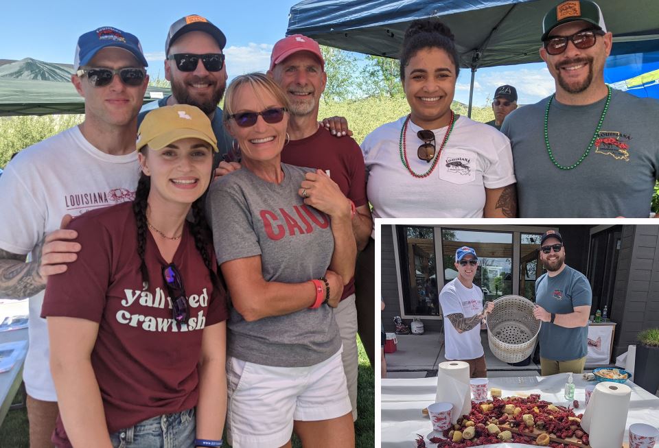 Photo of a male employee with his family at a charitable crawfish boil