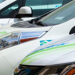 Electric vehicles parked in a row