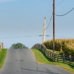 Power lines near farm fields in the fall