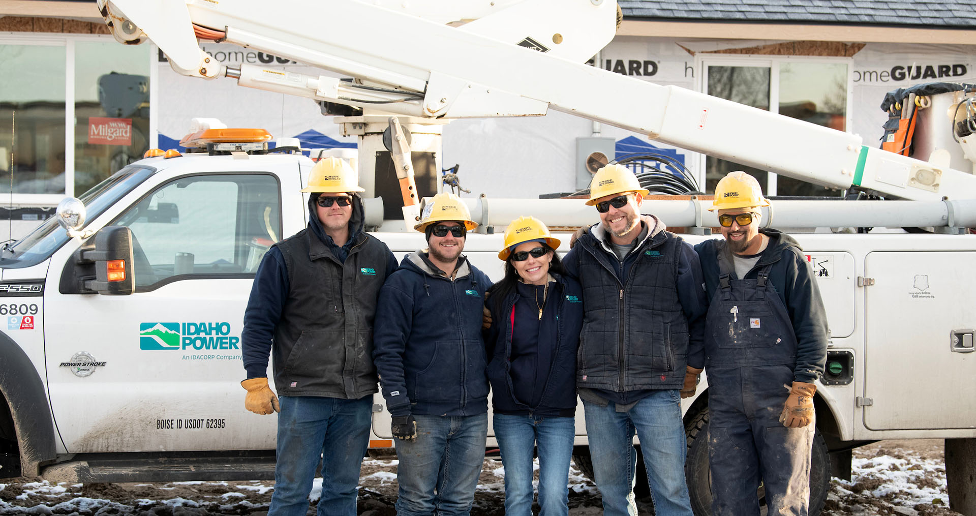 Image of Idaho Power employees in the field beside a truck
