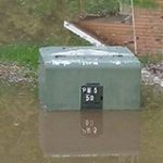 Permalink to Safety Warning: Stay Away From Flooded Electrical Equipment Image of a flooded ground transformer box.