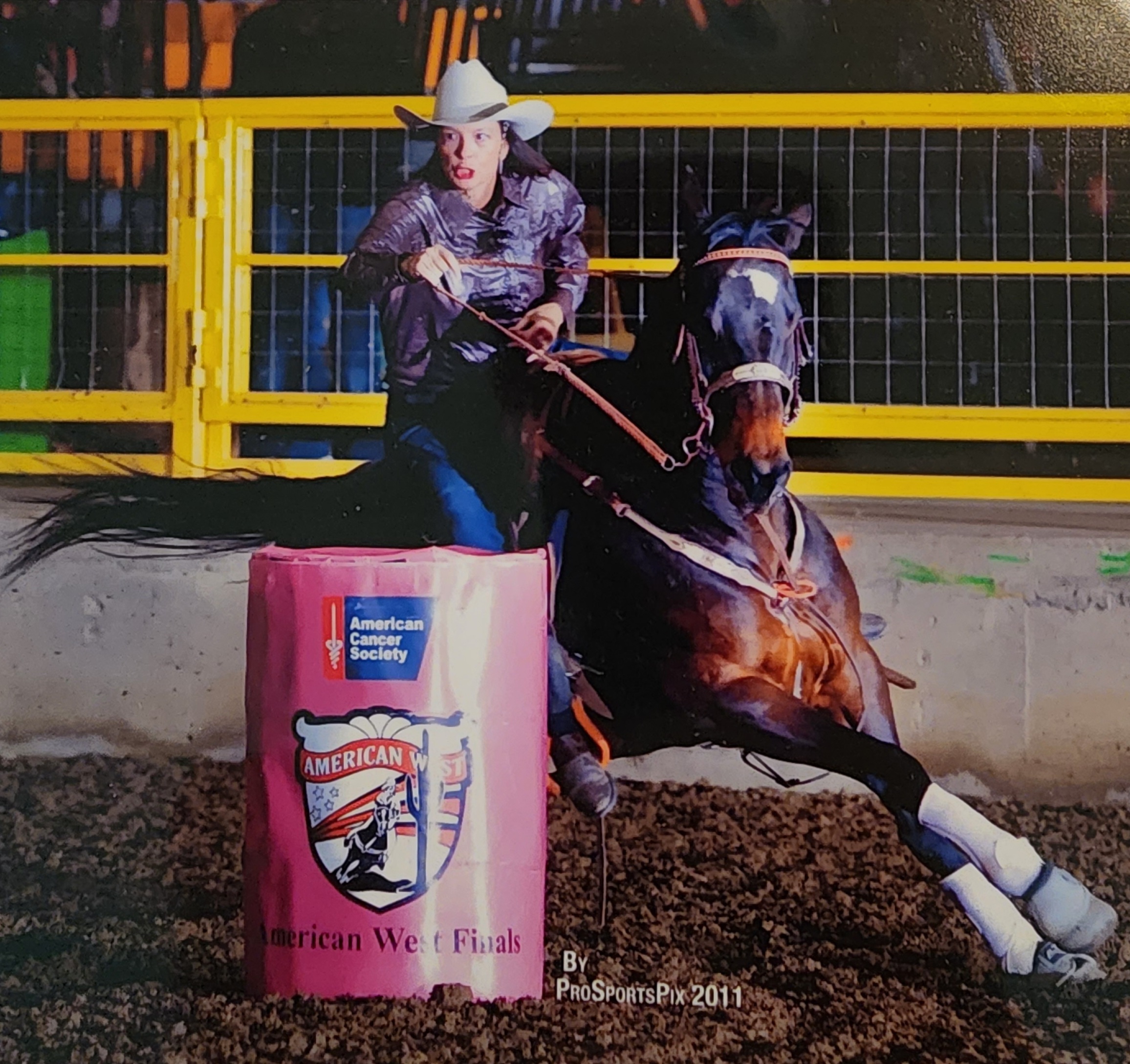 Joey riding her horse around a barrel