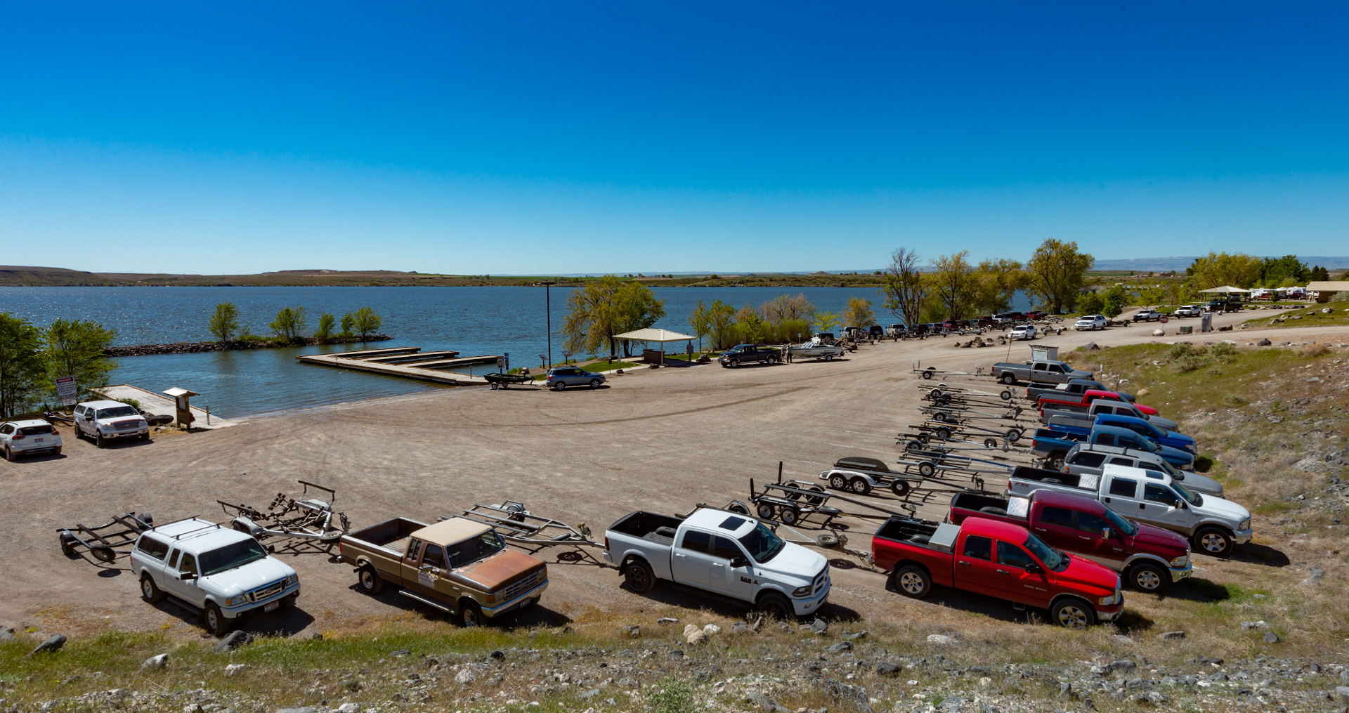 trucks and trailers parked at c.j. strike dam boat ramp