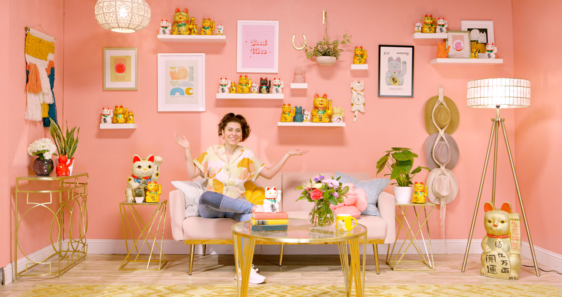 Tina sitting on her couch bringing good energy into her room