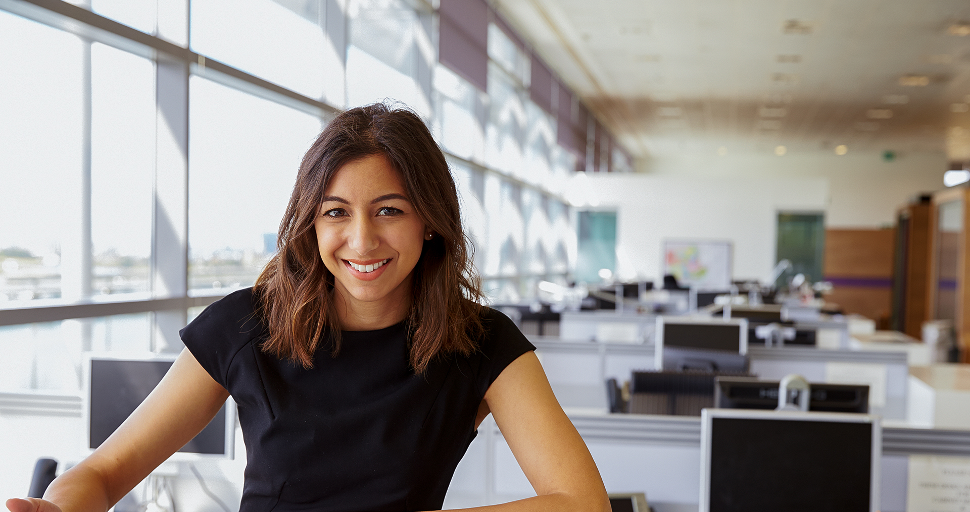 a woman working in an office building